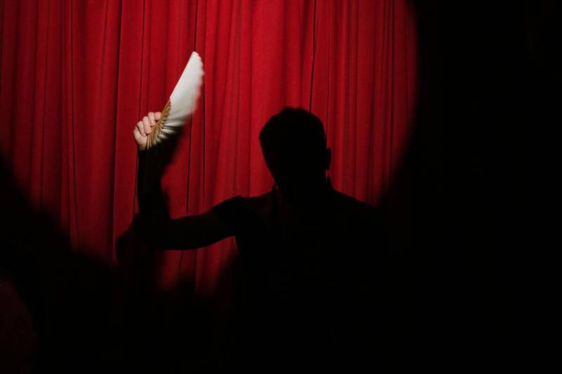 A woman with a fan, a detail from a Broadway Show